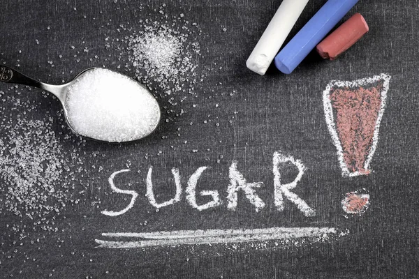 Azúcar. Palabra escrita con tiza en una pizarra —  Fotos de Stock