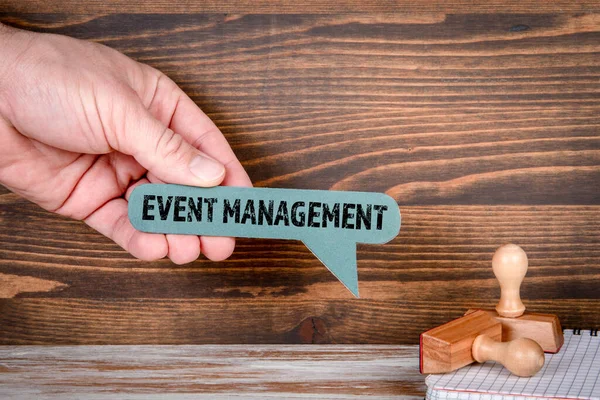 Event Management. Green speech bubble in a mans hand — Stock Fotó