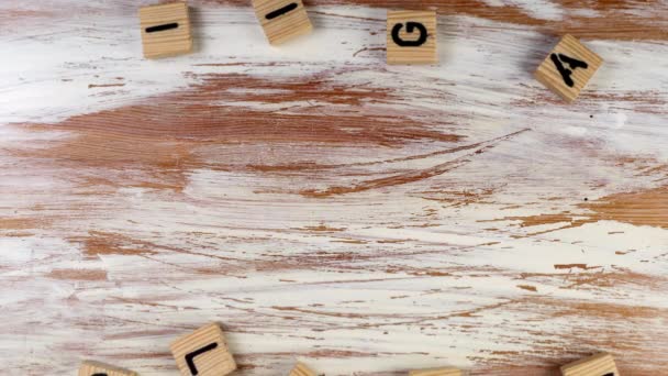 BILINGUAL. Skills, learning and knowledge concept. Text on a wooden background — Vídeo de Stock