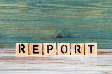 Report. Business and education concept. Text from wooden alphabet blocks