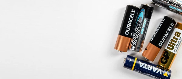 Duracell, Varta, Energizer, GP Ultra AA alkaline batteries are on horizontal white background — Stock Photo, Image