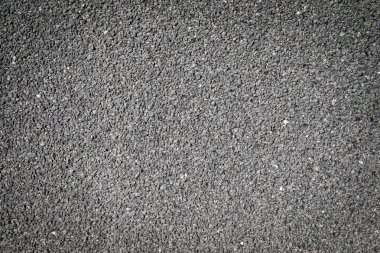 Gri alçı arka plan. Küçük taşların yüzeyi