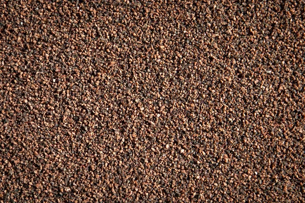 小さな石で茶色のセメント石膏.要旨の背景 — ストック写真