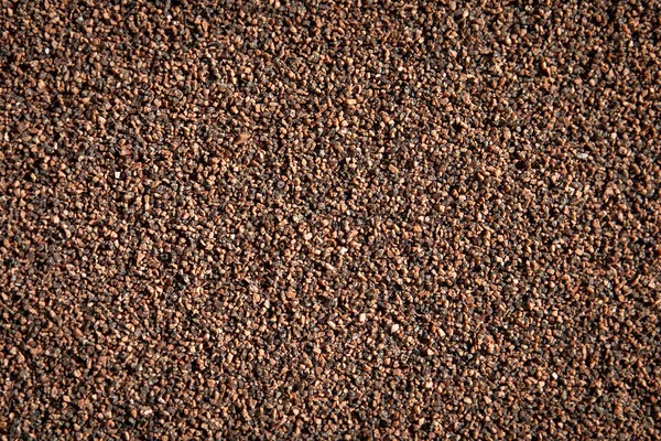 Brown cement plaster with small stones. Abstract background — Zdjęcie stockowe