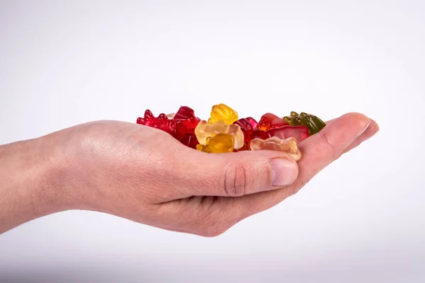 Red Rubber Candy Bear Palm Woman White Background — Stock Photo, Image