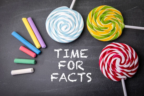 Time Facts Text Candy Dark Board — Stock Photo, Image