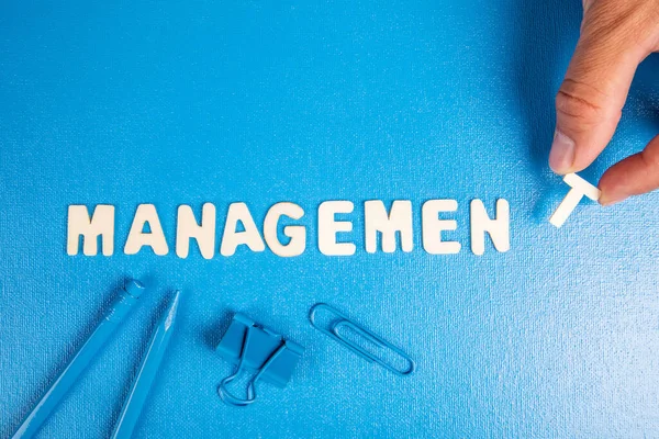 Management Concept Text White Wooden Letters Blue Background — Stock Fotó