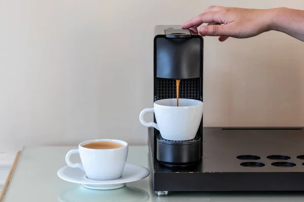 Capsule coffee machine. Making morning coffee. Hotel.