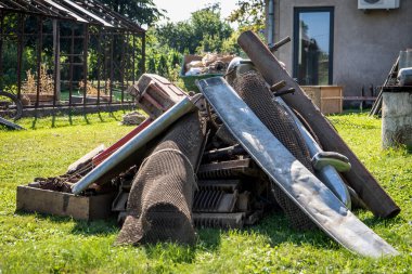 Scrap metal collection. Dirty backyard. Pickers and collectors.
