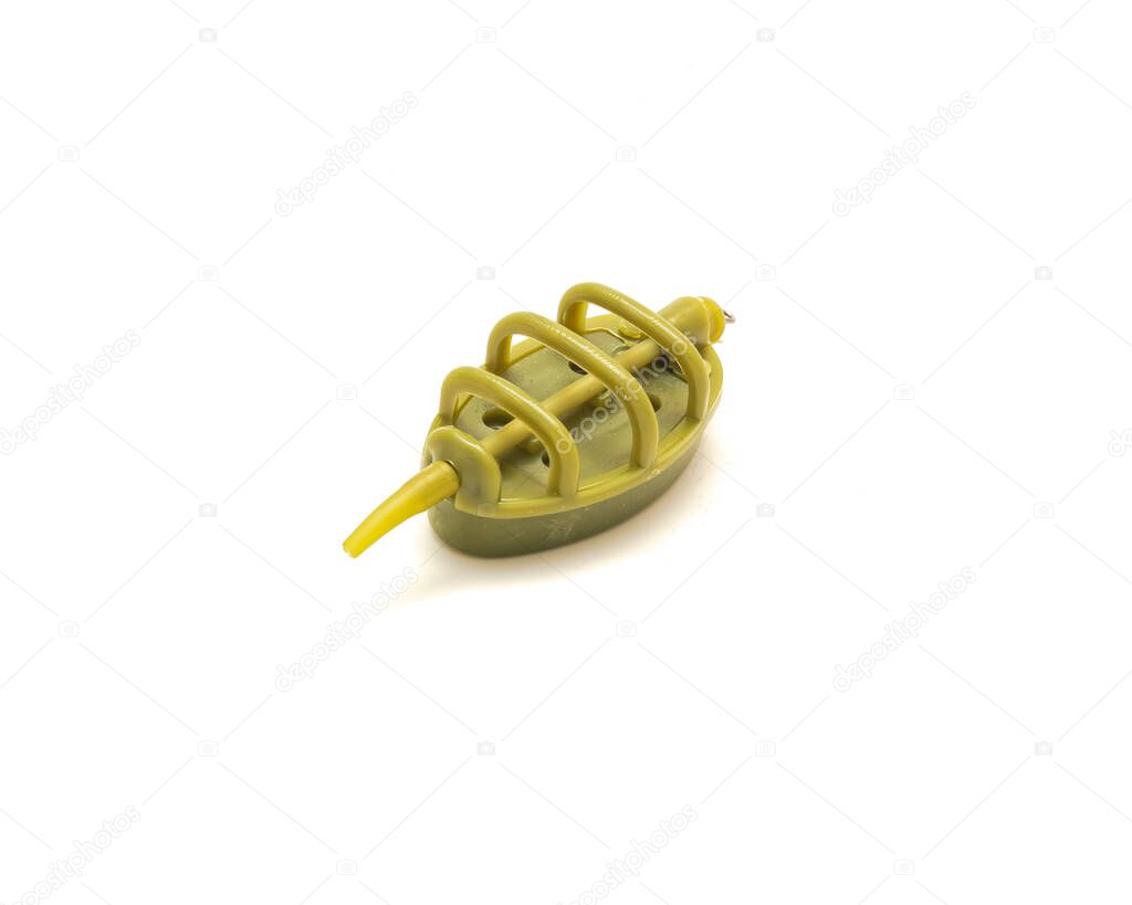 Single plastic inline flat feeder for carp fishing bait holder tool isolated on white background. Croch fishing tackle accessory.