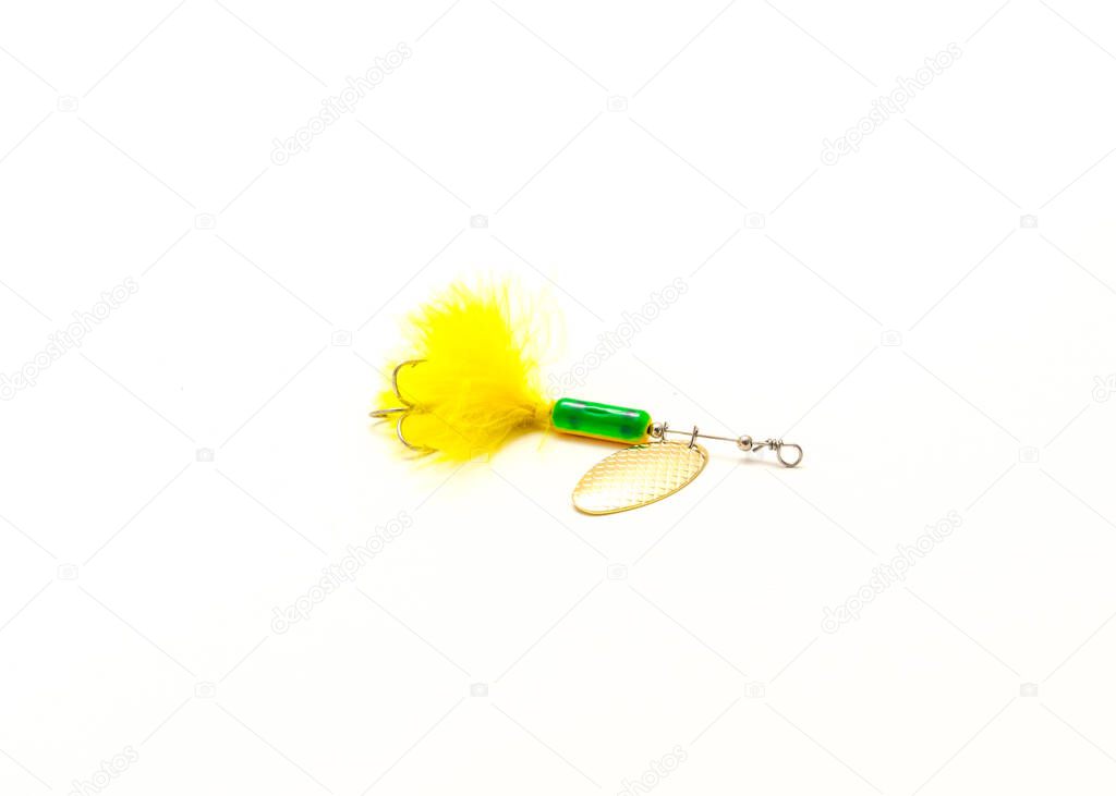 Single inline spinner lure with treble hooks isolated on white background. Rooster tail fishing tackle.