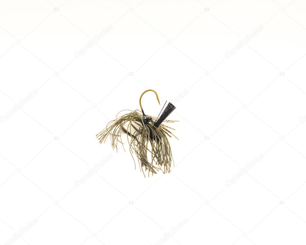 Top view football jig mimics crayfish with ultra-point hook isolated on white background. Bottom dragging lure for bass fishing.