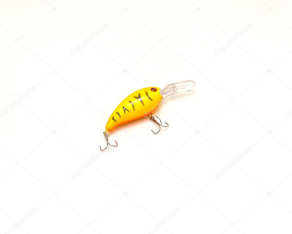 One crankbait artificial fishing lure isolated on white background. Fishing tackle that has hard body, and it mimics the appearance of a baitfish