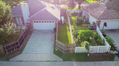 Aerial view back alley of residential neighborhood with backyard garden near Dallas, Texas, America. Homegrown organic foods at homestead residential houses, self sufficient