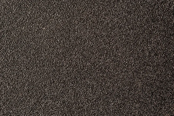 De zwarte textuur van het metaal is beschilderd met reliëf verf. — Stockfoto