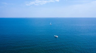 Blue water and waves and blue sky. Horizon on the sea. Abstract natural background.