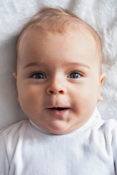 Cheerful Little Boy Baby Lies White Blanket Close — Photo