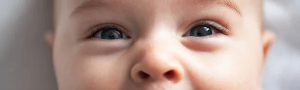 Cheerful Little Boy Baby Lies White Blanket Close — Stockfoto