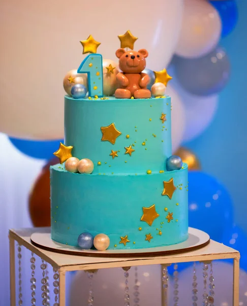Blue turquoise cake for the baby\'s birthday. Celebrating the first year of a child\'s life.