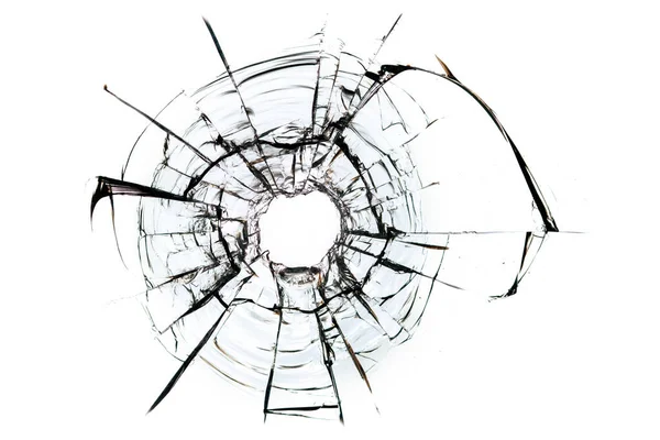 cracks in the glass, a hole from bullets in the glass on a white background. Window glass texture.