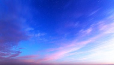 Orange sky after sunset or before dawn. A wonderful natural landscape. Pink clouds and blue starry sky.