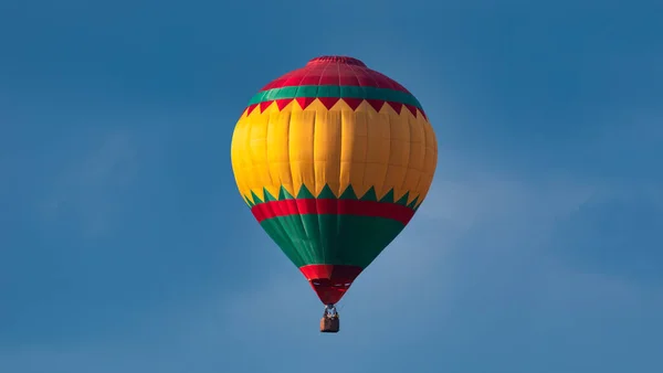 multi-colored balloon, balloon on the background of the blue sky. Concept, extreme types of tourism.