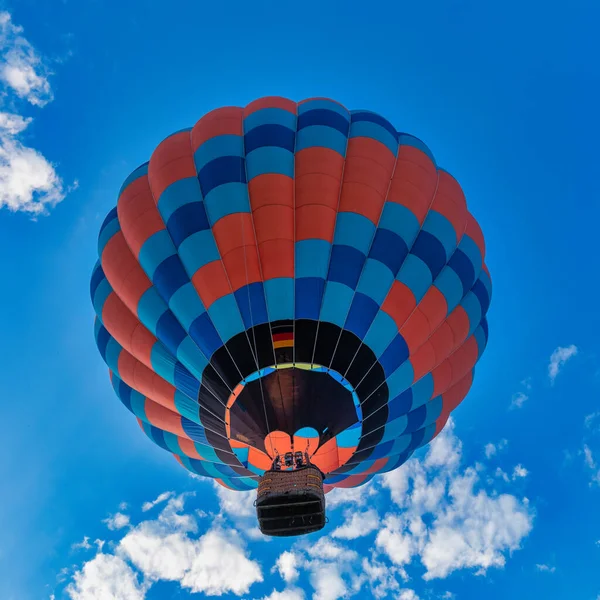 multi-colored balloon, balloon on the background of the blue sky. Concept, extreme types of tourism.