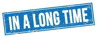 Mavi grungy dikdörtgen damga işareti üzerinde uzun bir Time metni.