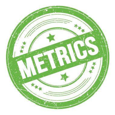 Yeşil yuvarlak grungy doku damgası üzerine METRICS metni.