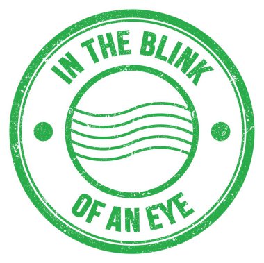 Yeşil yuvarlak posta mührü üzerine yazılmış bir göz kırpma metninde