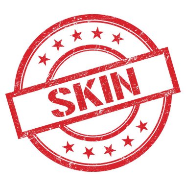 Kırmızı yuvarlak plastik damga üzerine yazılmış SKIN metni.