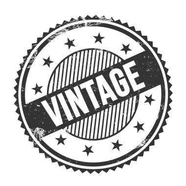Siyah grungy zig zag kenarları üzerine yazılmış VINTAGE metin yuvarlak pul.