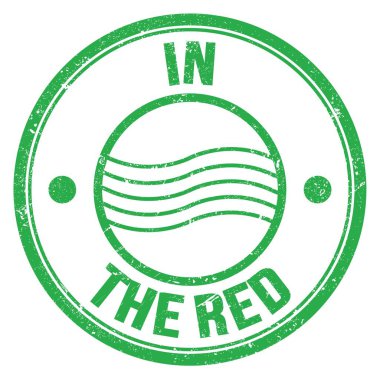 Yeşil yuvarlak posta mührü üzerine yazılmış kırmızı metinde