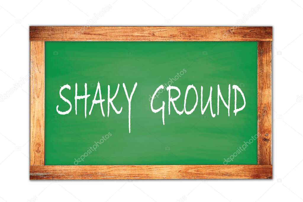 SHAKY  GROUND text written on green wooden frame school blackboard.