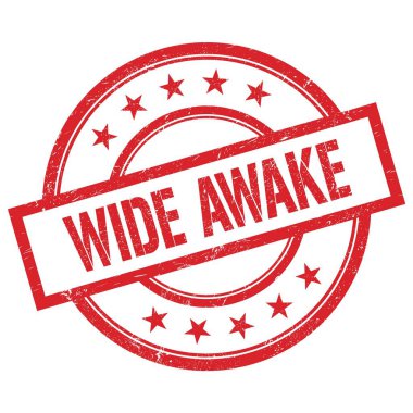 Geniş Awake metni kırmızı, yuvarlak, lastik damga üzerine yazılmış.