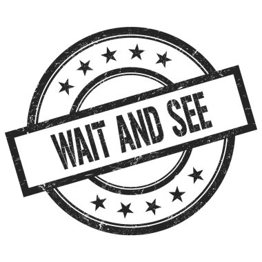 Bekle ve gör siyah yuvarlak vintage kauçuk damga üzerine yazılmış metin.