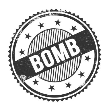 BOMB metni siyah grungy zig zag kenarları yuvarlak pul üzerine yazılmış.