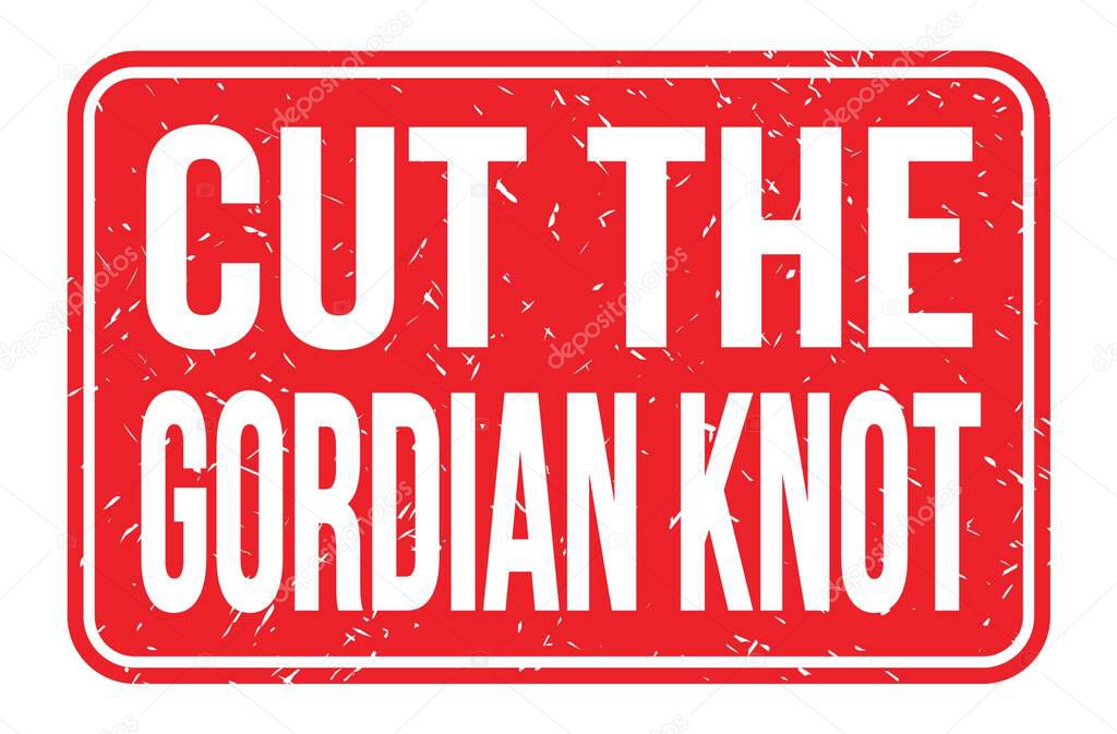 CUT THE GORDIAN KNOT, words written on red rectangle stamp sign