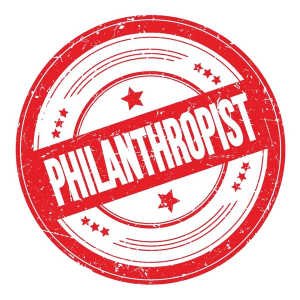 Kırmızı yuvarlak kirli doku damgası üzerine PHILANTHROPIST metin.