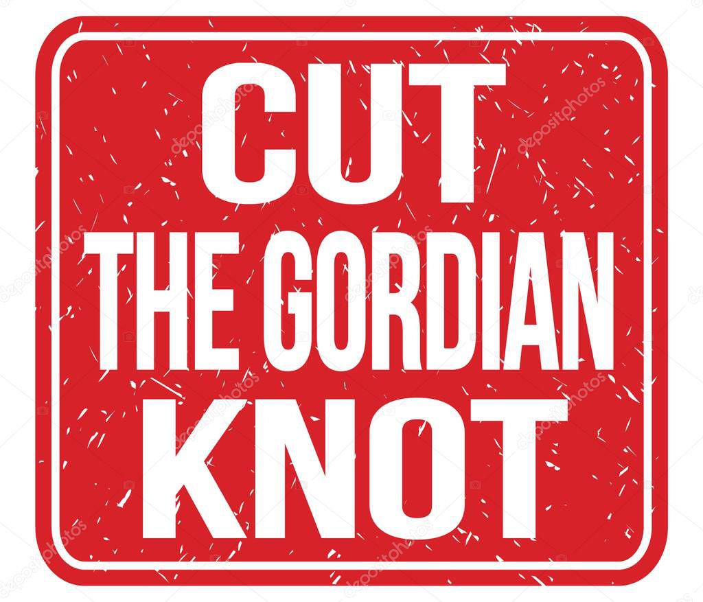 CUT THE GORDIAN KNOT, text written on red stamp sign