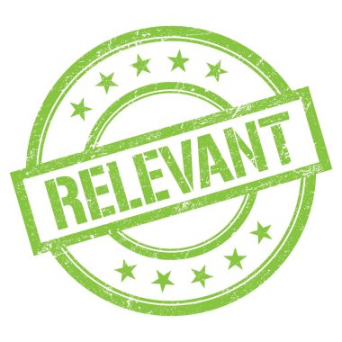 RELEVANT text written on green round vintage rubber stamp.