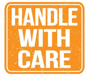 HANDLE WITH CARE, text written on orange vintage stamp sign