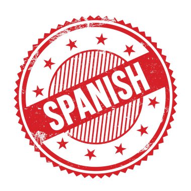 SPANISH text written on red grungy zig zag borders round stamp.