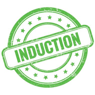 Yeşil vintage grungy yuvarlak kauçuk damga üzerine INDUCTION metin.