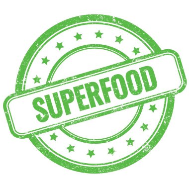 Yeşil antika lastik damgalı SUPERFOOD metni.