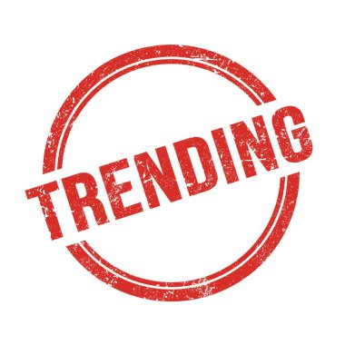 Kırmızı grungy vintage yuvarlak damga üzerine yazılmış TRENDING metin.