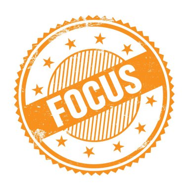 Turuncu grungy zig zag kenarları üzerine yazılmış FOCUS metni pul yuvarlak.