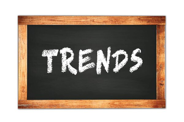 TRENDS text written on black wooden frame school blackboard.