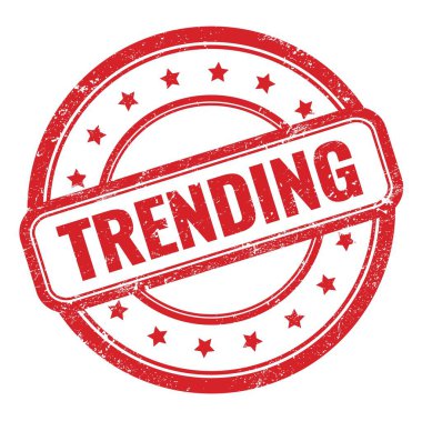 Kırmızı grungy vintage yuvarlak kauçuk damga üzerinde TRENDING metin.