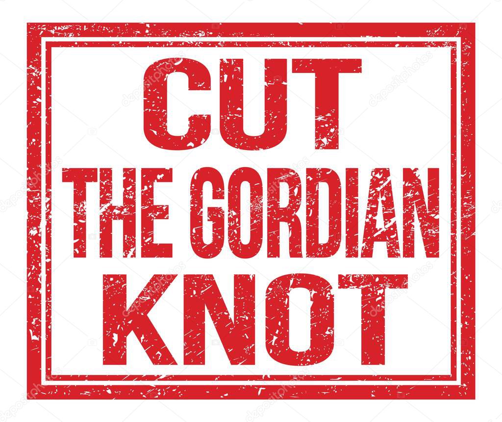 CUT THE GORDIAN KNOT, written on red grungy stamp sign
